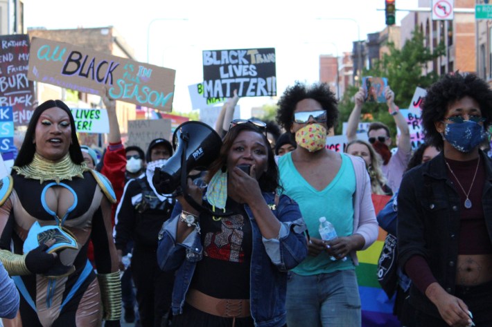 Zahara Bassett (center), a director at Brave Space Alliance, a Black- and trans-led LGBTQ center on the South Side, rallies protesters during the Drag March for Change.  |  Jake Witch/Block Club Chicago