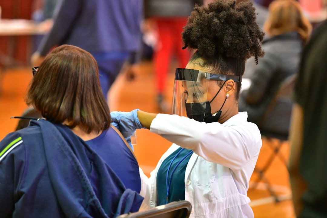 Black And Latino Chicagoans Want The Vaccine — They're Just Struggling