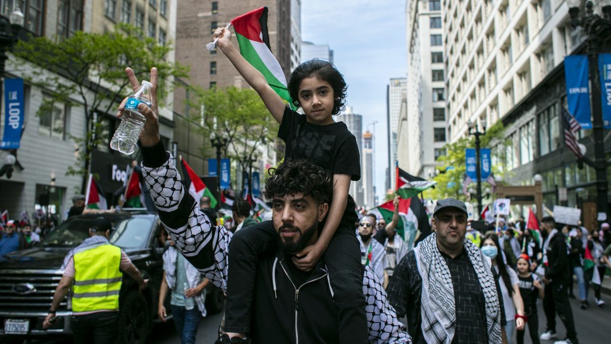 Thousands March Through Downtown Chicago Sunday In Solidarity With